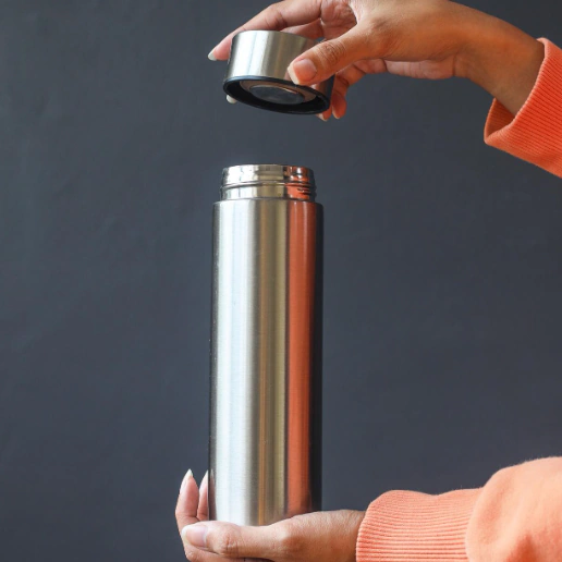 a person holding vacuum flasks