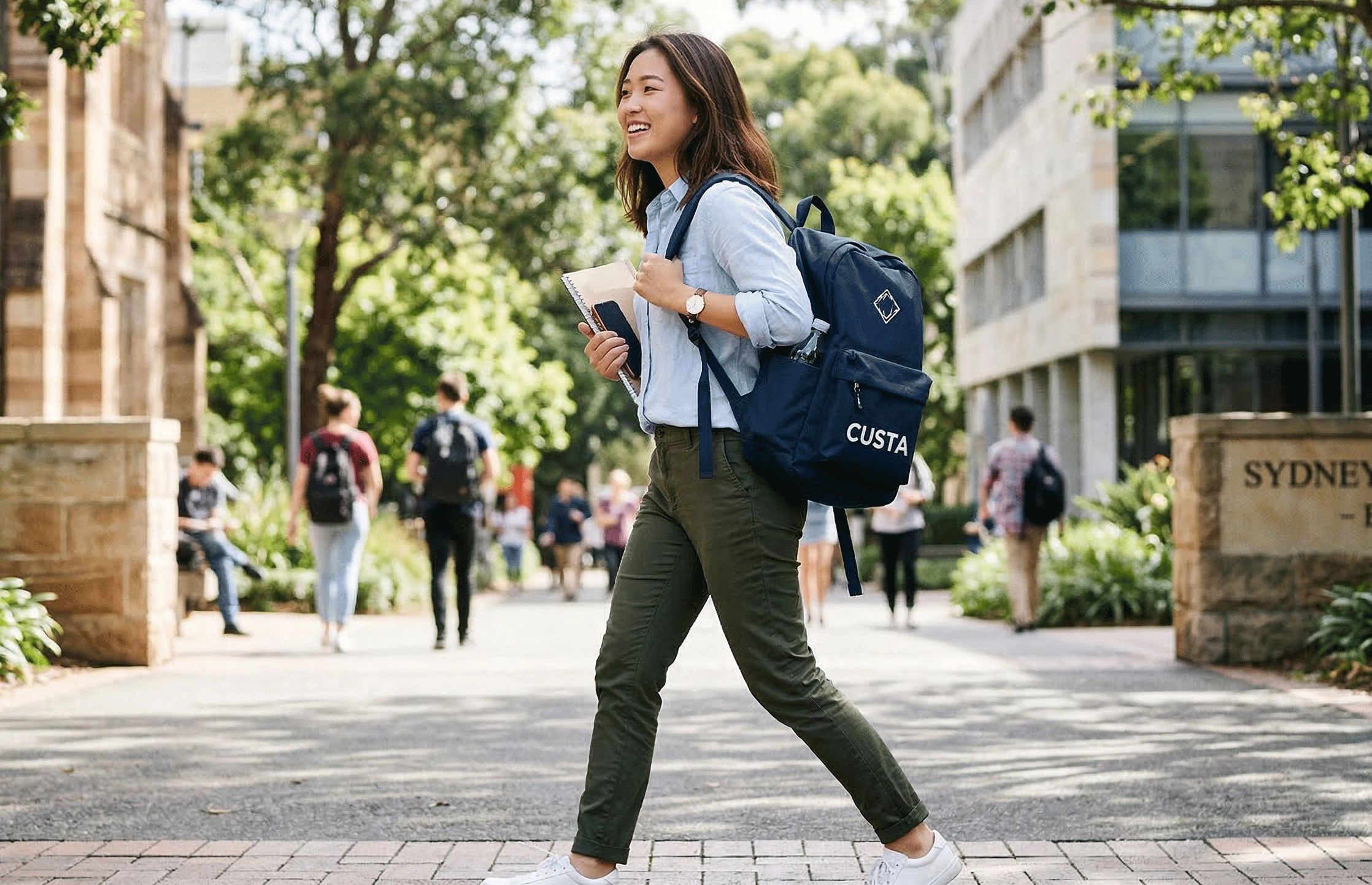 A woman carrying a personalised custom backpack on campus — CUSTA Malaysia
